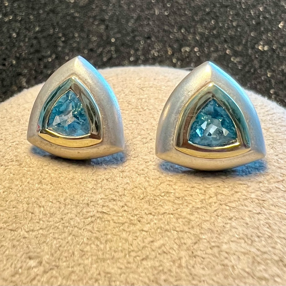 Two toned post earrings with teal blue topaz, 14k gold 925 China.
